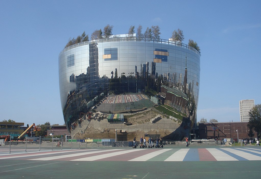 Photo of the exterior of the mirrored, egg-shaped Depot Museum Boijmans Van Beuningen