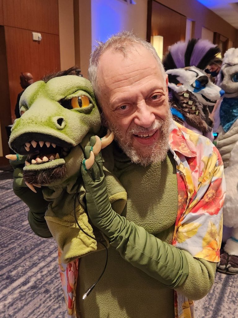 Photo of Joe Strike with his fursuit, "Komos"